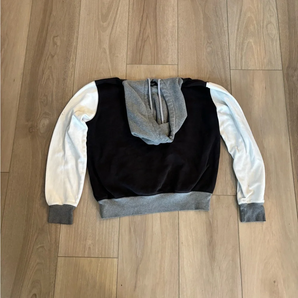 The North Face Black Gray and white color blocked men’s Hoodie jacket sweater